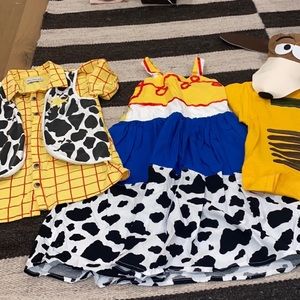 Boys woody top and girls Jessie dress. Both in excellent condition.